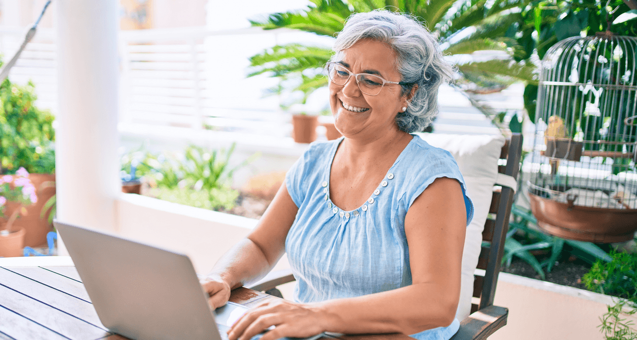 NDIS participant reviewing their service agreement on their laptop